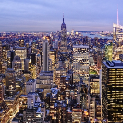 Aerial view of highrise buildings in cityscape at twilight