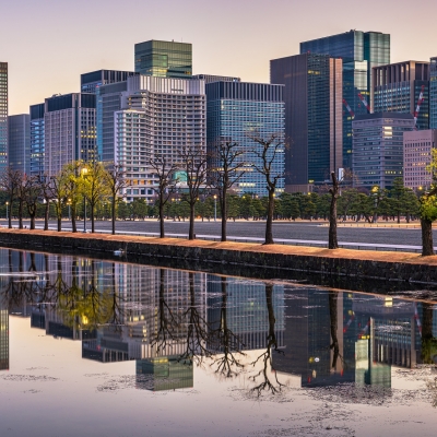 Modern Office Buildings and water reflection in Tokyo, Japan.